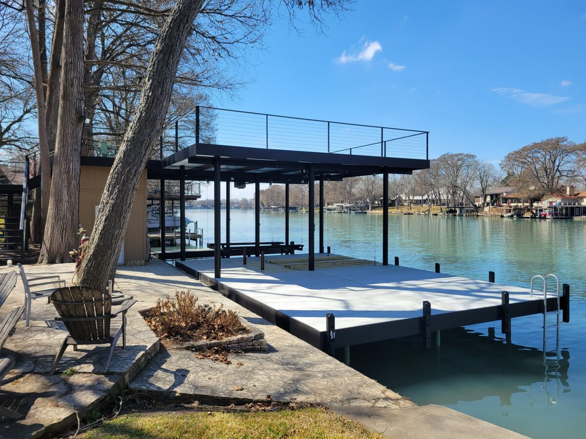 Boathouse with jet ski lift on Lake McQueeney built by Waterfront Unlimited