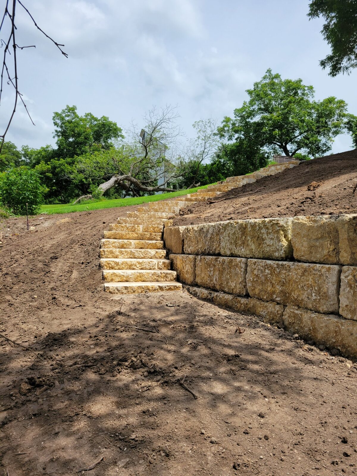 Limestone retaining wall construction on Canyon Lake by Waterfront Unlimited